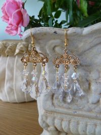 Our Swarovski crystal filigree earrings are totally stunning on. Each earring has 7 delicate crystals and 3 baroque crystals strung to a filigree mount. Sparkles when capturing the light. 
 Price: &pound;35.84